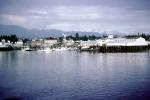 Harbor, boats, piers, Ketchikan Waterfront, skyline, city, town, mountains,  July 1969