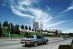 amazing clouds, buildings, highway, cars