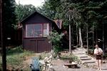 Peacham Pond, cabin, home, house, man, trunks, July 1962, COEV03P08_13