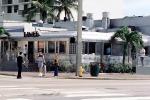 Art-deco diner, metal building, palm tree