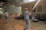 Homeowner, House, Protecting his Home, Malibu Fire, California, DAFV05P06_06