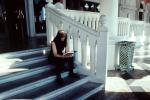 Woman Reading on steps
