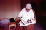 Man Reading a book, Algeria, EBCV01P04_02