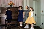Woman Playing Piano, Girls Sing, 1959, EMNV01P01_02