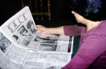 Newspaper Sale, Woman Reading the Oakland Tribune Newpaper, ENCV01P03_18