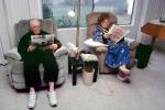 Couple reading the morning newspaper, ENCV01P05_14