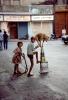Boy and his Acrobat Dog, Balancing On Wobbly Tin Cans, Mumbai