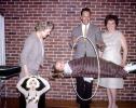 Floating girl through a hoop, brick wall, man woman, magician, magic, 1960s, ETHV01P04_14