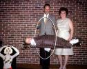 Floating girl through a hoop, brick wall, man woman, magician, magic, 1960s, ETHV01P04_16