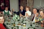 Funny Man Toast Glasses at a Dinner Party, Woman, plates, formal, 1960s, FDNV01P01_10