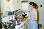 Woman Cooking in the Kitchen, Meat, Gas Stove, frying pan, egg beater, May 1960, 1960s