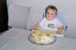 Smilling baby, toddler, pineapple cake, bib, smiles, cute, highchair, messy, 1970s, FDNV02P15_03