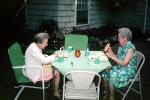 Backyard, lunch, women, Hot dogs, chairs, 1960s, FDNV02P15_06