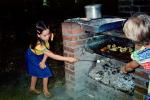 Girl roasting marshmellows, BBQ, Barbecue, 1977, 1970s, FDNV03P03_04
