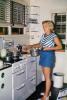 Woman cooking, stove, pot, shorts, range, trash can, 1950s