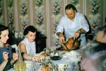 Thanksgiving Dinner, woman, man, cutting, slicing the turkey, 1940s, FDNV03P03_12