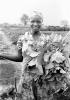 Woman, Harvesting her Crops, Smiles