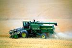 Harvesting Wheat with Mechanized Combines, John Deere Turbo 6622 Combine, farmfield, wheat field, golden amber waves of grain, swather, windrower, FMNV04P06_11