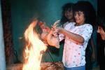 Girl Roasting a chicken, Chicken Slaughterhouse, San Salvador, El Salvador, FPMV01P01_12