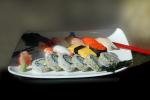 sushi, chopsticks, ginger, saki bottle, plate, platter, ebi, ikura, octopus