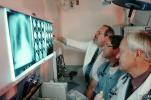Doctors Looking at X-Ray, light box, Woman, Men, HHPV01P13_02