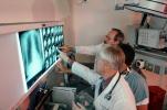 Doctors Looking at X-Ray, light box, Woman, Men, HHPV01P13_04