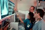 Doctors Looking at X-Ray, light box, Woman, Men