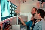 Doctors Looking at X-Ray, light box, Woman, Men, HHPV01P13_12