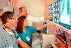 Doctors Looking at X-Ray, light box, Woman, Men, HHPV01P13_13B