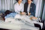 Patient in a body cast, Nurse, Baby Powder, Legs, Bed, 1949, 1940s, Spicacast