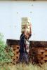Woman carrying bricks, Ambostria, ICBV01P08_04