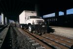 GMC 7500 Truck on Railroad Tracks