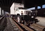 GMC 7500 Truck on Railroad Tracks