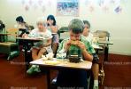 classroom, student, Boy, Male, Guy, cupcake, smiles, eating, Children Eating Lunch, desk, KEDV02P06_12