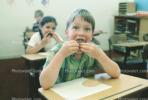 classroom, student, Boy, Male, Guy, cupcake, smiles, eating, Children Eating Lunch, desk, KEDV02P07_03