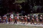Schoolkids marching with Rifles