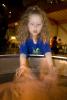 Girl playing with Sand, hands-on exhibit, touch