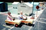 Girls, Crosswalk, Sidewalk, Schoolhouse, Pedal Car, July 1984, 1980s, KEPV01P03_08