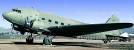 A C-47 at rest on the ground, drab green, MYFV09P08_16B