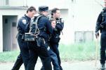 Police arrest a boy, resisting arrest, handcuffed, Policeman, Operation Kernel Blitz, urban warfare training