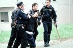 Police arrest a boy, resisting arrest, handcuffed, Policeman, Operation Kernel Blitz, urban warfare training, MYMV02P12_18