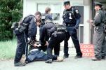 Police arrest a boy, resisting arrest, handcuffed, Policeman, Operation Kernel Blitz, urban warfare training, MYMV02P12_19