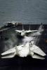 Grumman F-14 Tomcat readies for take-off, steam