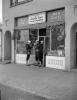 Soldiers guarding a store owned by Japanese right after Pearl Harbor, WW2, World War-II, WWII, Internment Camps, 1940s, MYNV18P04_17