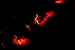 flying over the lava flowing into the ocean at night