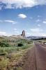 Outcropping, volcanic throat, road, highway, butte