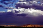 deep dark looming clouds, hills, NSUV06P01_14