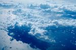 Flying over the Ocean, daytime, daylight, Cumulus Cloud Puffs, puffy, ocean