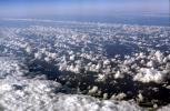 flying over the midwest USA during the winter, daytime, daylight, cumulus puffs, NWSV21P03_19