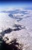 split in the clouds, flying over the midwest USA during the winter, daytime, daylight